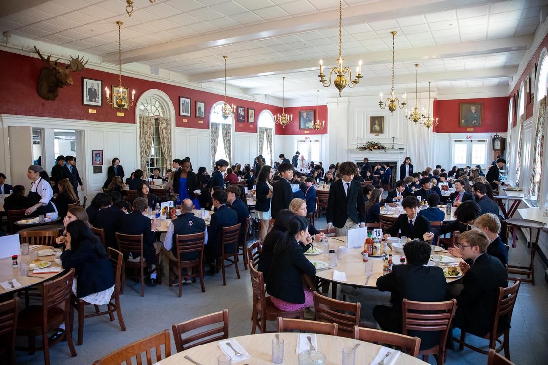 Fay School Photo #9 - Family-style meals at Fay are a longstanding tradition. Faculty members join the students for meals and students take turns as waiters. It is an opportunity to relax with friends and catch up on school news.
