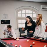 Stuart Hall School Photo #6 - Students take a break with a game of pool in the Student Center