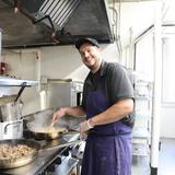North Yarmouth Academy Photo #15 - NYA's chef at work in the Safford Center kitchen. NYA Dining is committed to building meaningful relationships with each student, ensuring the offerings reflect the needs and preferences of our community. Our goal is to provide students with the sustenance they need to thrive throughout their week, while continuously seeking opportunities to surprise and delight their taste buds.