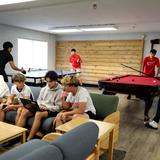 Saint Andrew's School Photo #12 - Residential Life students hanging out in the Boys Dorm lobby.